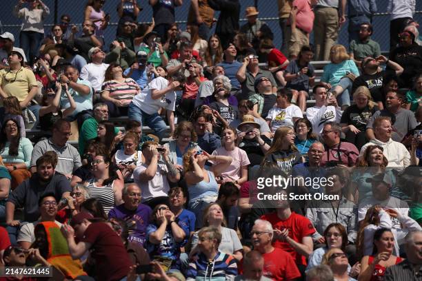 People view the eclipse on the campus of Southern Illinois University on April 08, 2024 in Carbondale, Illinois. Millions of people have flocked to...