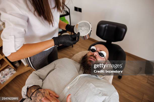 laser epilation of beard contour - female body waxing stock pictures, royalty-free photos & images