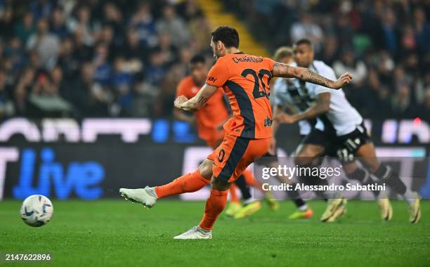 Hakan Calhanoglu of FC Internazionale scores his team's first goal from the penalty spot during the Serie A TIM match between Udinese Calcio and FC...