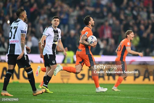 Hakan Calhanoglu of FC Internazionale celebrates scoring his team's first goal from the penalty spot during the Serie A TIM match between Udinese...