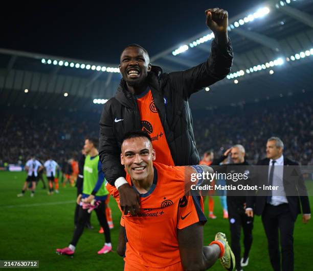 Lautaro Martinez and Marcus Thuram of FC Internazionale celebrates the win at the end of the Serie A TIM match between Udinese Calcio and FC...