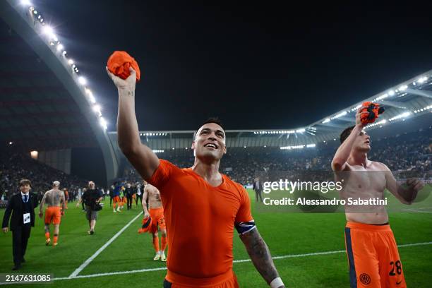 Lautaro Martinez of FC Internazionale throws his match shirt into the crowd of fans following victory in the Serie A TIM match between Udinese Calcio...