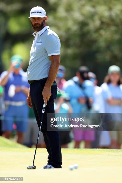 Dustin Johnson of the United States watches his putt on the seventh green during a practice round prior to the 2024 Masters Tournament at Augusta...