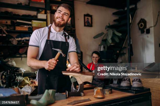 team of young cobblers - leather shoe stock pictures, royalty-free photos & images