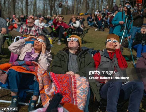 People watch a total solar eclipse at the top of Mt Philo State Park on April 08, 2024 in Charlotte, Vermont. Half of Vermont was in the path of the...