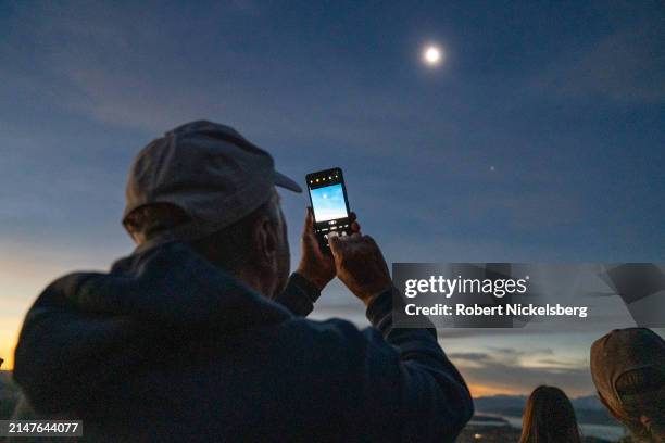 People watch a total solar eclipse at the top of Mt Philo State Park on April 08, 2024 in Charlotte, Vermont. Half of Vermont was in the path of the...