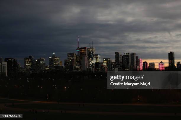 The city is shown during the total solar eclipse at Riverdale Park on April 08, 2024 in Toronto, Ontario. Millions of people have flocked to areas...