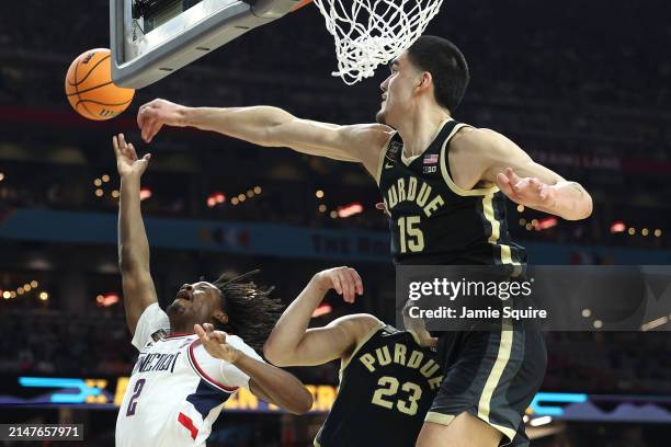 Zach Edey of the Purdue Boilermakers blocks a shot attempt by Tristen Newton of the Connecticut Huskies in the first half during the NCAA Men's...