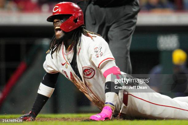Elly De La Cruz of the Cincinnati Reds reacts after hitting an inside-the-park home run against the Milwaukee Brewers in the seventh inning of a...