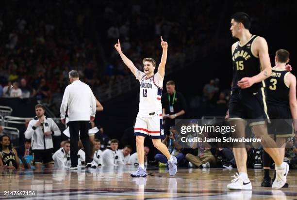 Cam Spencer of the Connecticut Huskies celebrates during the second half in the NCAA Men's Basketball Tournament National Championship game at State...