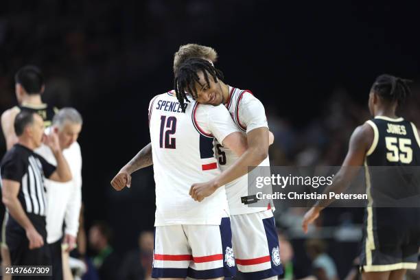 Cam Spencer and Stephon Castle of the Connecticut Huskies celebrate after beating the Purdue Boilermakers 75-60 to win the NCAA Men's Basketball...