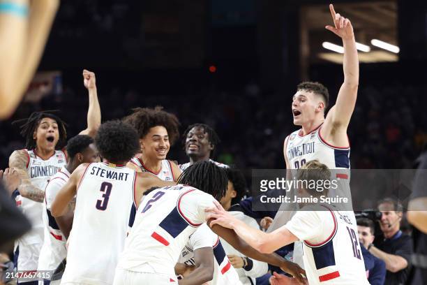 The Connecticut Huskies celebrate after beating the Purdue Boilermakers 75-60 to win the NCAA Men's Basketball Tournament National Championship game...