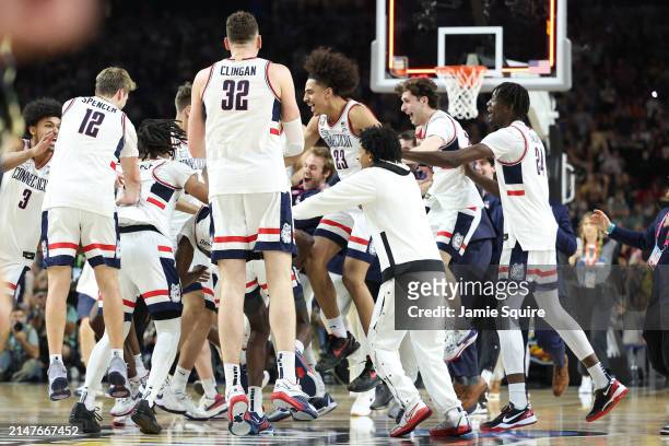 The Connecticut Huskies celebrate after beating the Purdue Boilermakers 75-60 to win the NCAA Men's Basketball Tournament National Championship game...