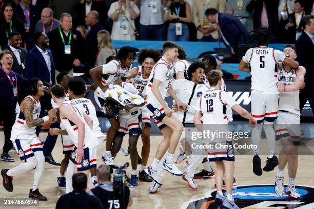 The Connecticut Huskies celebrate after beating the Purdue Boilermakers 75-60 to win the NCAA Men's Basketball Tournament National Championship game...