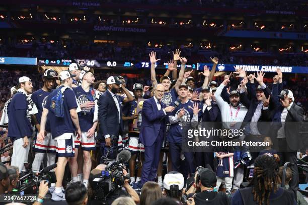 The Connecticut Huskies celebrate with the trophy after beating the Purdue Boilermakers 75-60 to win the NCAA Men's Basketball Tournament National...