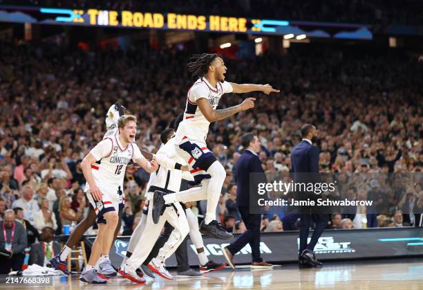 The Connecticut Huskies celebrate after defeating the Purdue Boilermakers in the NCAA Men's Basketball Tournament National Championship game at State...