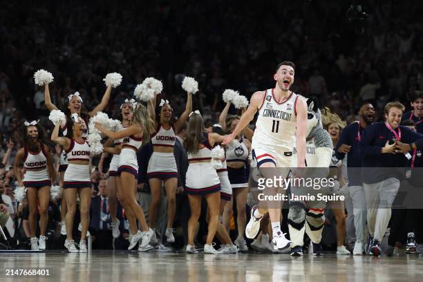 Alex Karaban of the Connecticut Huskies celebrates after beating the Purdue Boilermakers 75-60 to win the NCAA Men's Basketball Tournament National...
