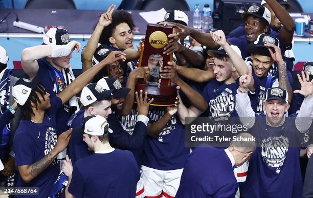 Connecticut Huskies celebrate after defeating the Purdue Boilermakers in the NCAA Men's Basketball Tournament National Championship game at State...
