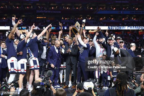 The Connecticut Huskies celebrate with the trophy after beating the Purdue Boilermakers 75-60 to win the NCAA Men's Basketball Tournament National...