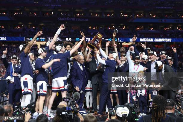 The Connecticut Huskies celebrate with the trophy after beating the Purdue Boilermakers 75-60 to win the NCAA Men's Basketball Tournament National...