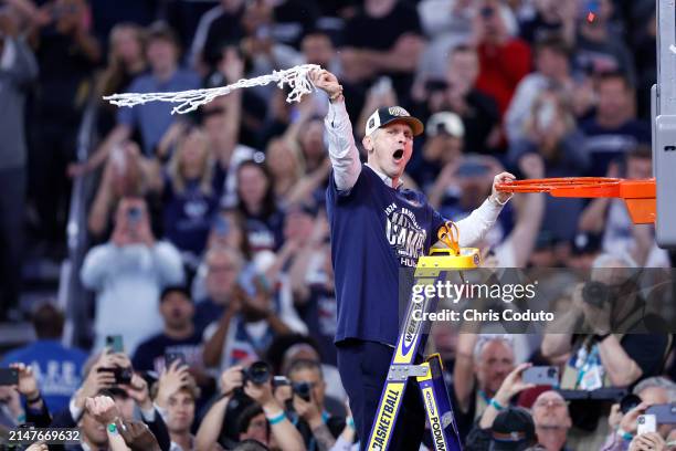 Head coach Dan Hurley of the Connecticut Huskies cuts down the net after beating the Purdue Boilermakers 75-60 to win the NCAA Men's Basketball...