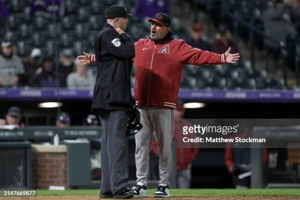 Manager Torey Lovullo of the Arizona Diamondbacks disputes a third strike call on Ketel Marte with home plate umpire Nic Lentz while playing the...