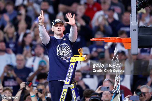 Head coach Dan Hurley of the Connecticut Huskies cuts down the net after beating the Purdue Boilermakers 75-60 to win the NCAA Men's Basketball...