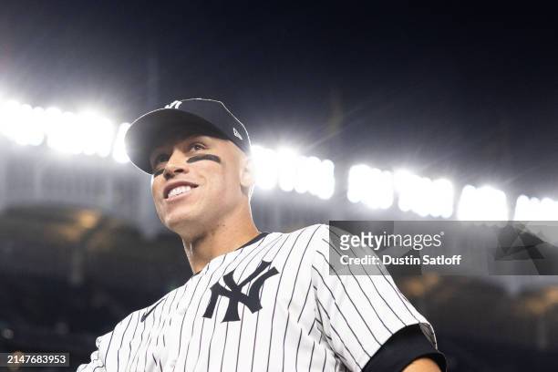 Aaron Judge of the New York Yankees jogs off the field during the middle of the seventh inning of the game against the Miami Marlins at Yankee...