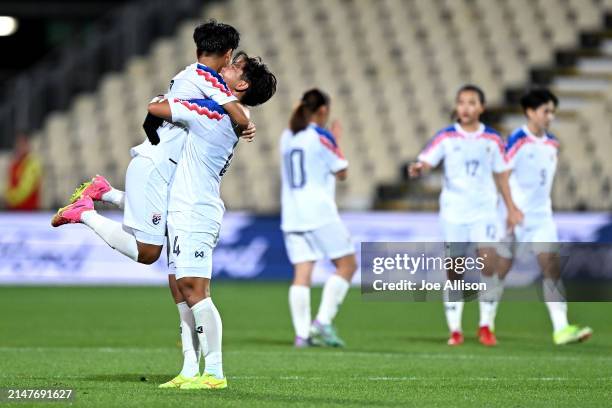 Kanjanaporn Saenkhun and Phonphirun Philawan of Thailand celebrate following the International Friendly match between New Zealand Football Ferns and...