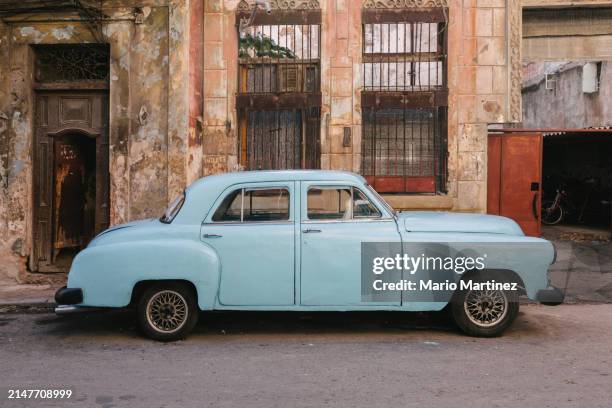 vintage car parked in old havana - cuban culture stock pictures, royalty-free photos & images