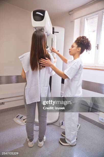 female doctor and patient during mammography test in examination room - mammogram stock pictures, royalty-free photos & images