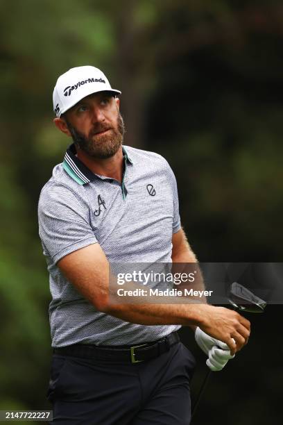 Dustin Johnson of the United States plays his shot from the 11th tee during a practice round prior to the 2024 Masters Tournament at Augusta National...