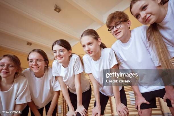 high school students in gym - physical education lesson stock pictures, royalty-free photos & images