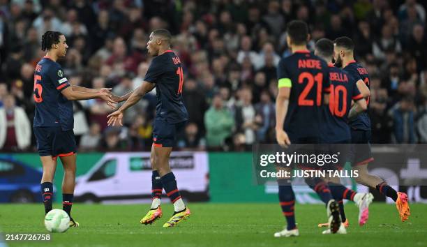 Lille's French defender Bafode Diakite celebrates scoring the team's first goal during the UEFA Europa Conference League quarter-final first leg...