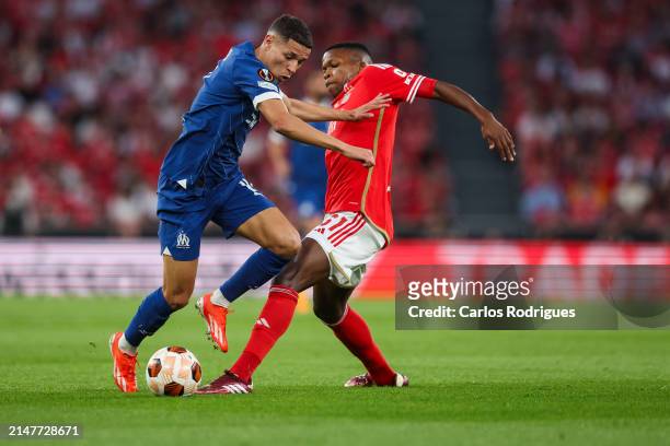 Amine Harit of Olympique Marseille tries to escape Florentino Luis of SL Benfica during the UEFA Europa League 2023/24 Quarter-Final first leg match...