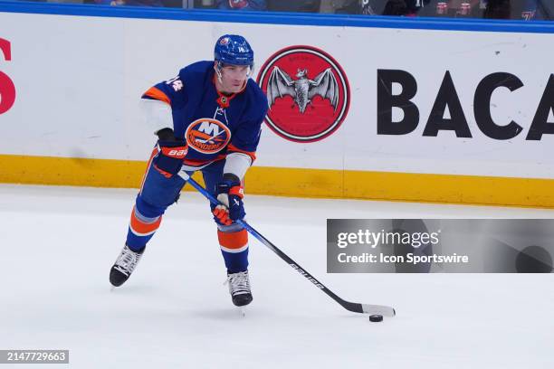 Boston Bruins Defenseman Ian Mitchell controls the puck during the first period of the National Hockey League game between the New York Rangers and...