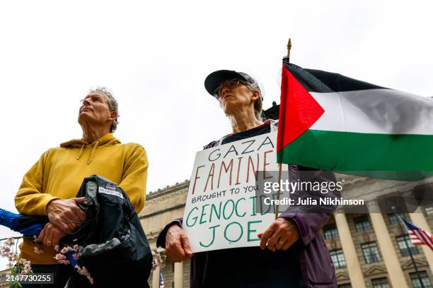 People attend a vigil for aid workers killed in the Gaza war on April 11, 2024 in Washington, DC. Seven World Central Kitchen aid workers died in a...