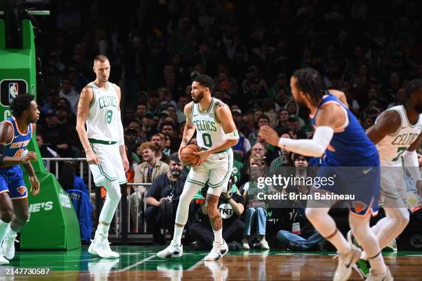 Jayson Tatum of the Boston Celtics looks to pass the ball during the game against the New York Knicks on April 11, 2024 at the TD Garden in Boston,...