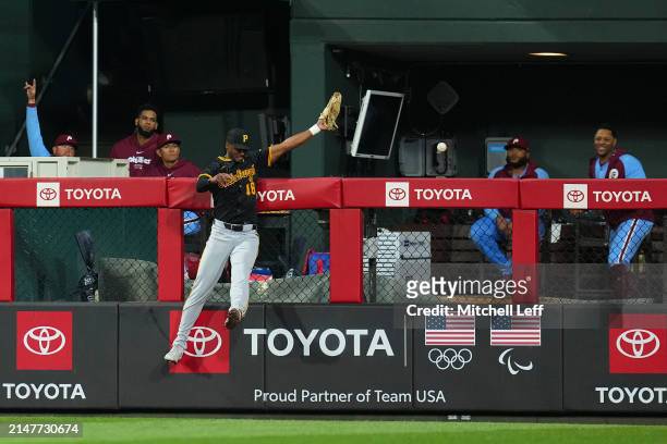 Michael A. Taylor of the Pittsburgh Pirates cannot make the catch on a solo home run hit by Alec Bohm of the Philadelphia Phillies in the bottom of...