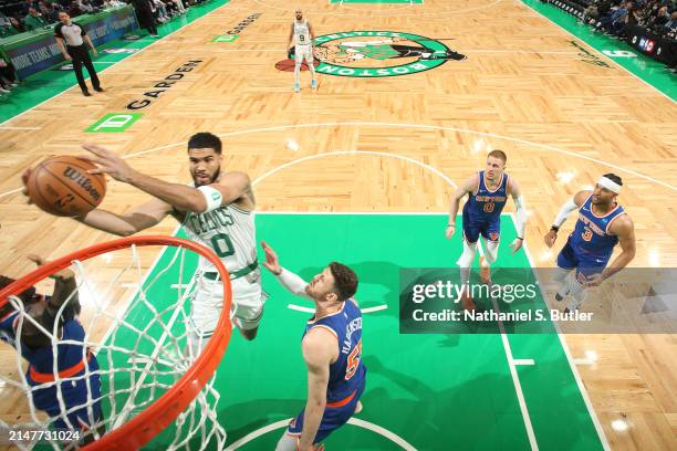 Jayson Tatum of the Boston Celtics drives to the basket during the game against the New York Knicks on April 11, 2024 at the TD Garden in Boston,...