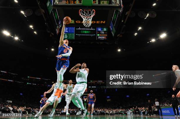 Donte Divincenzo of the New York Knicks drives to the basket during the game against the Boston Celtics on April 11, 2024 at the TD Garden in Boston,...