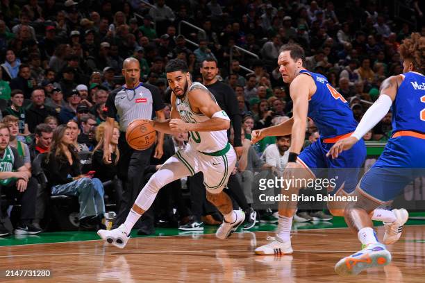 Jayson Tatum of the Boston Celtics dribbles the ball during the game against the New York Knicks on April 11, 2024 at the TD Garden in Boston,...