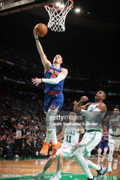 Donte Divincenzo of the New York Knicks drives to the basket during the game against the Boston Celtics on April 11, 2024 at the TD Garden in Boston,...