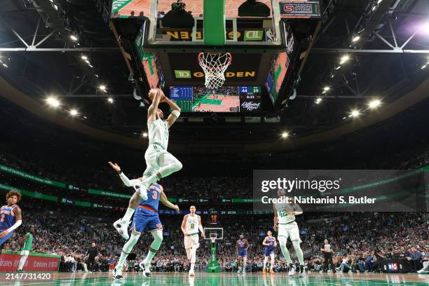 Jayson Tatum of the Boston Celtics dunks the ball during the game against the New York Knicks on April 11, 2024 at the TD Garden in Boston,...