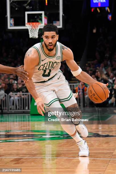 Jayson Tatum of the Boston Celtics dribbles the ball during the game against the New York Knicks on April 11, 2024 at the TD Garden in Boston,...