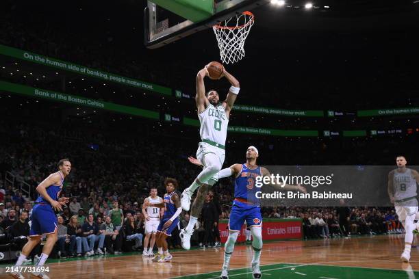 Jayson Tatum of the Boston Celtics dunks the ball during the game against the New York Knicks on April 11, 2024 at the TD Garden in Boston,...