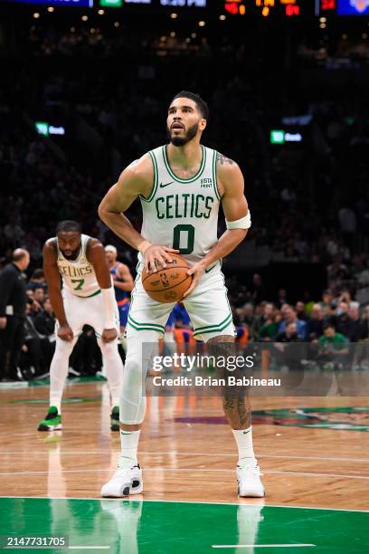 Jayson Tatum of the Boston Celtics shoots a free throw during the game against the New York Knicks on April 11, 2024 at the TD Garden in Boston,...