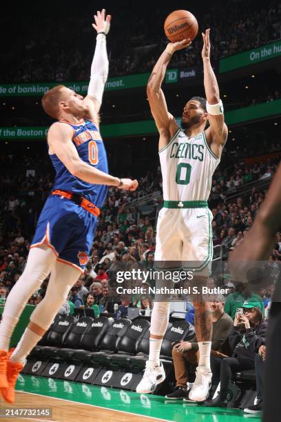 Jayson Tatum of the Boston Celtics shoots a three point basket during the game against the New York Knicks on April 11, 2024 at the TD Garden in...