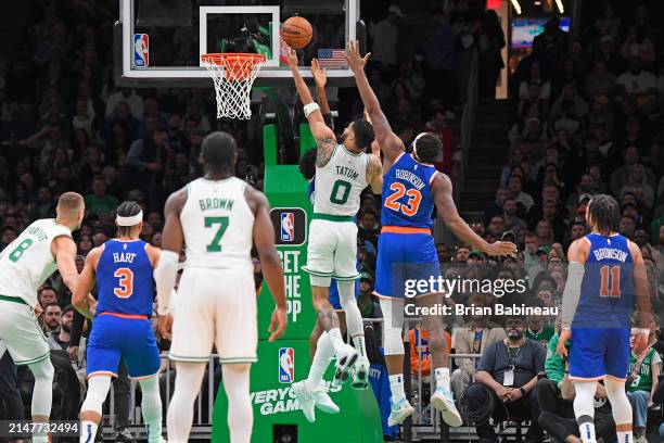 Jayson Tatum of the Boston Celtics drives to the basket during the game against the New York Knicks on April 11, 2024 at the TD Garden in Boston,...