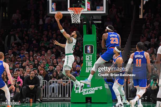 Jayson Tatum of the Boston Celtics drives to the basket during the game against the New York Knicks on April 11, 2024 at the TD Garden in Boston,...